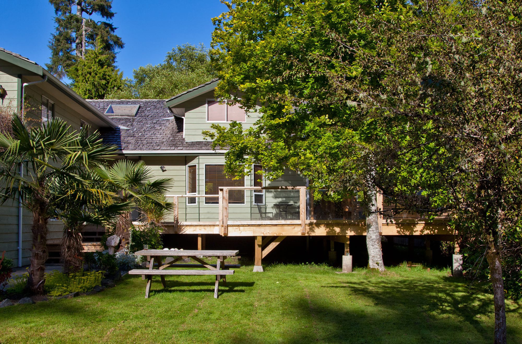 Nootka Tofino vacation rental exterior with lush garden and deck